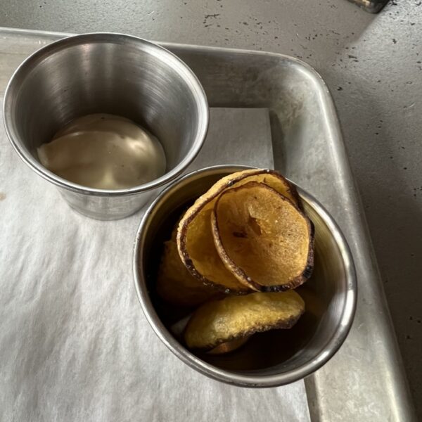 Chips and a dip in two steel containers