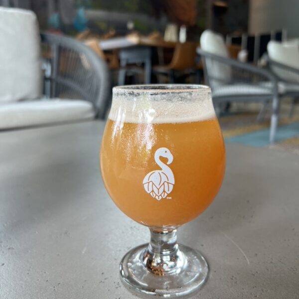 a glass of beer mixed with a juice